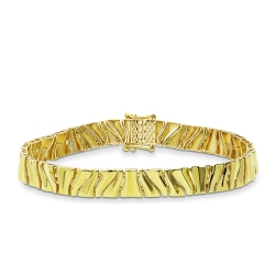 18k yellow gold bracelet with a wavy mirror-polished finish