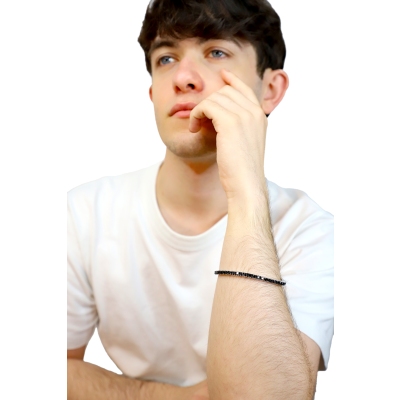 Elastic tennis bracelet with black diamonds in 750 white gold