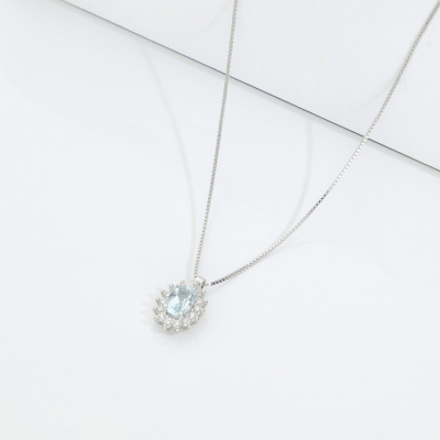 Diamond halo pendant necklace with aquamarine in 18kt white gold