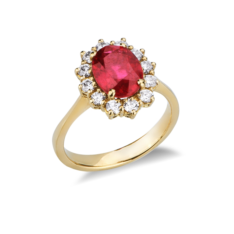Ruby and diamond halo ring in 18kt yellow gold Ruby and diamond halo ring in 18kt yellow gold