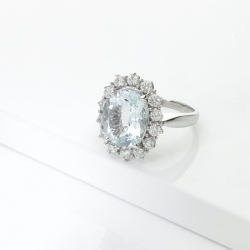 Halo ring with diamonds and aquamarine in 18kt white gold