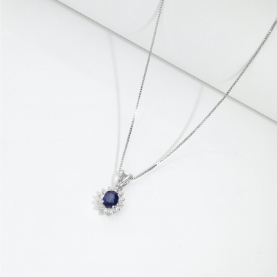 Blue sapphire diamond halo necklace in18kt white gold