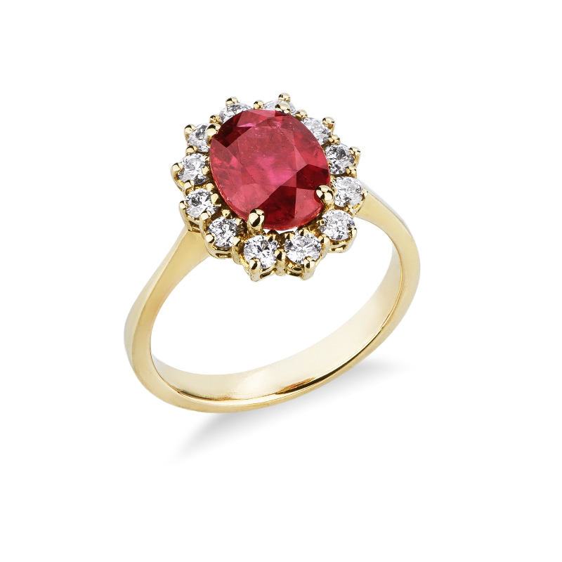 Ruby and diamond halo ring in 18kt yellow gold Ruby and diamond halo ring in 18kt yellow gold