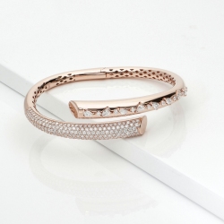Diamond bypass solid gold bracelet with diamonds