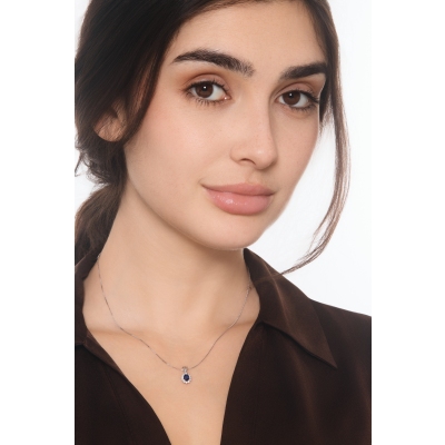 Blue sapphire diamond halo necklace in18kt white gold