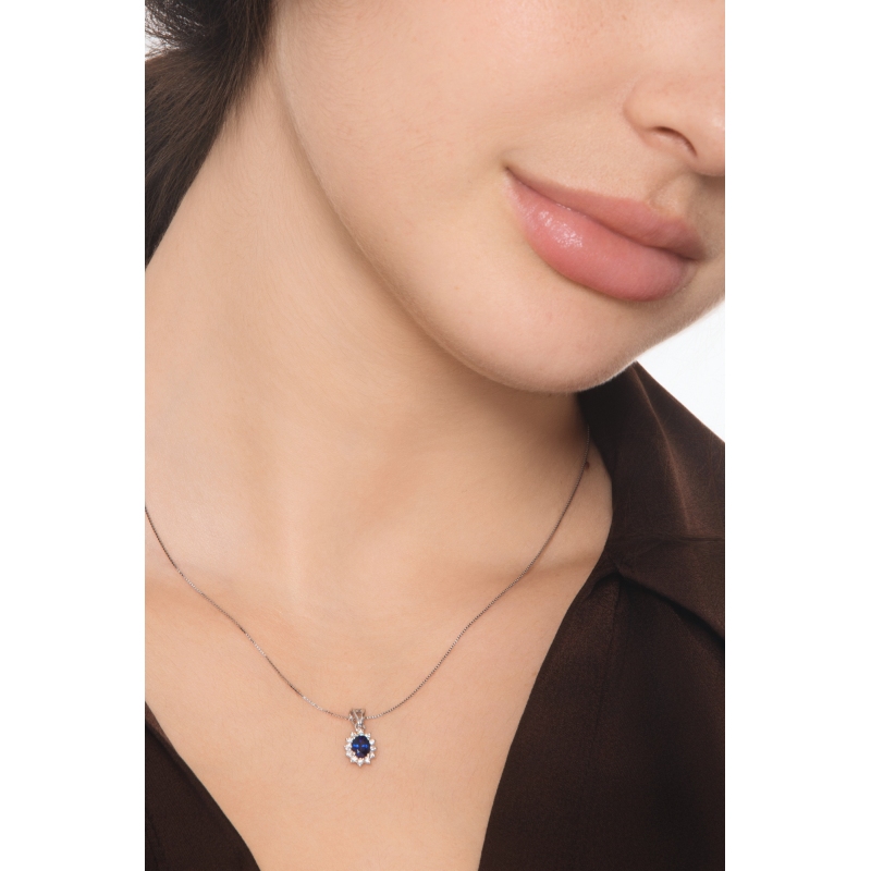 Blue sapphire diamond halo necklace in18kt white gold