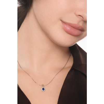 Blue sapphire diamond halo necklace in18kt white gold