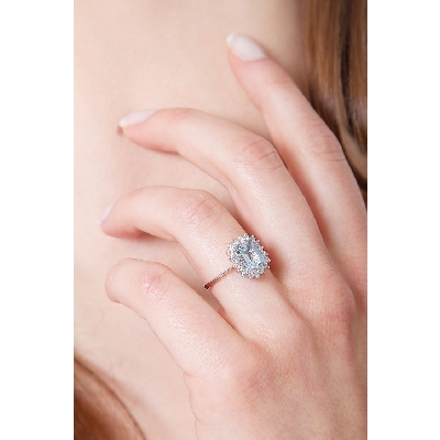 18k white gold halo ring with diamonds and aquamarine