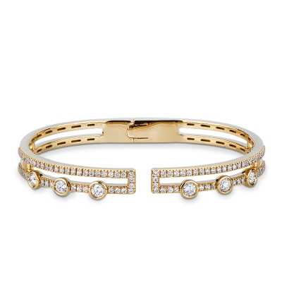 Semi-rigid cuff bracelet in 18kt yellow gold and diamonds