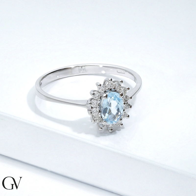 Halo ring white gold 18k with oval cut aquamarine and diamonds  Halo ring white gold 18k with oval cut aquamarine and diamonds