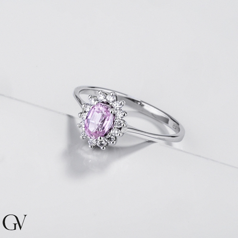 Diamond halo pink sapphire ring in 18kt white gold Diamond halo pink sapphire ring in 18kt white gold