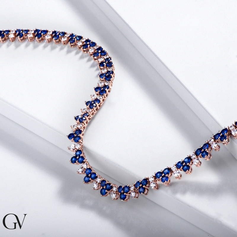 18k rose gold tennis necklace featuring blue sapphires and diamonds