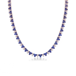 18k rose gold tennis necklace featuring blue sapphires and diamonds