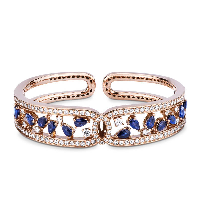 Cuff bracelet with diamonds and blue sapphires in 18kt gold