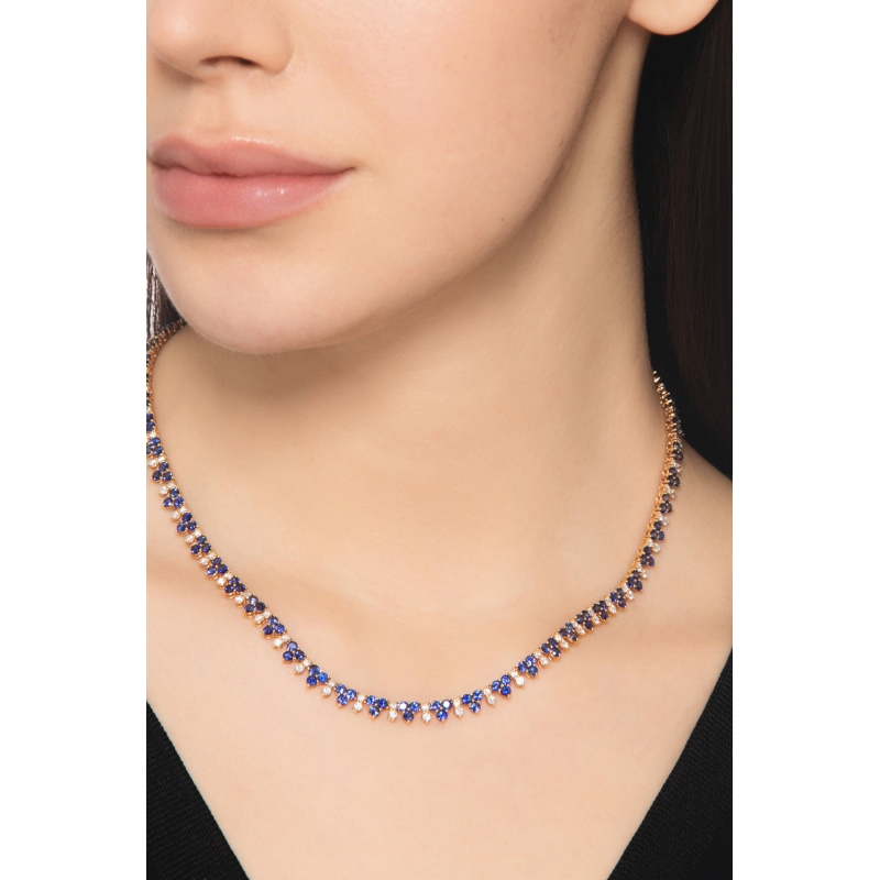 18k rose gold tennis necklace featuring blue sapphires and diamonds