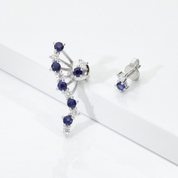 White gold 18k asymmetric design earrings with blue sapphires and diamonds