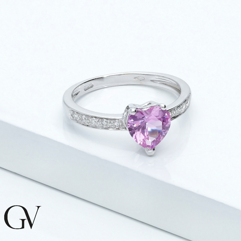 750 white gold ring with pink sapphire heart cut and diamonds shoulder set  750 white gold ring with pink sapphire heart cut and diamonds shoulder set