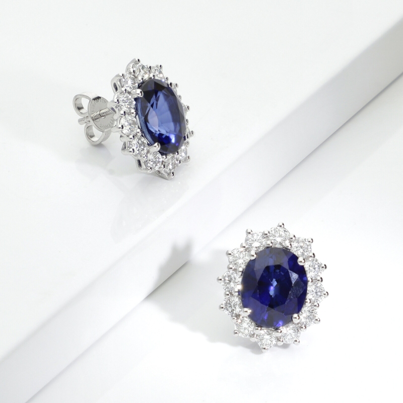 18k white gold halo earrings featuring blue sapphires and diamonds