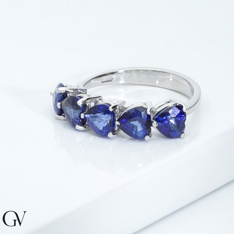White gold 18k ring with five blue sapphires heart cut  White gold 18k ring with five blue sapphires heart cut