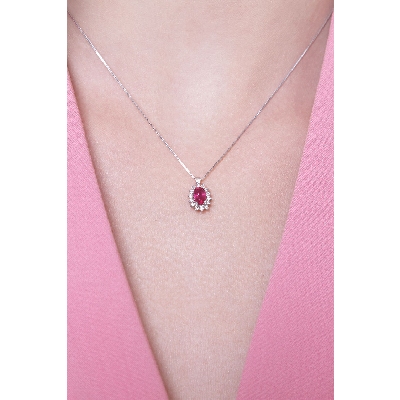 Necklace with pendant, oval cut ruby and diamond