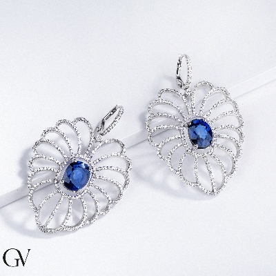 18k white gold drop earrings with a big oval pendant in diamonds and blue sapphire