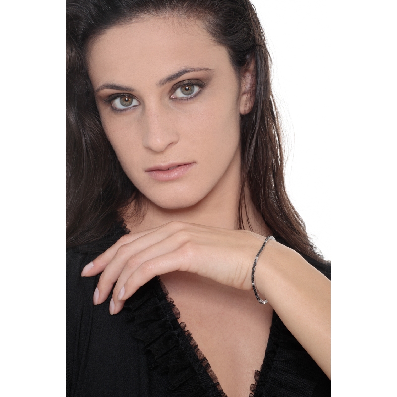 Wire style tennis bracelet with black and white round cut diamonds