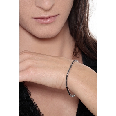 Wire style tennis bracelet with black and white round cut diamonds