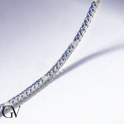 18k white gold tennis bracelet with blue sapphires and diamonds