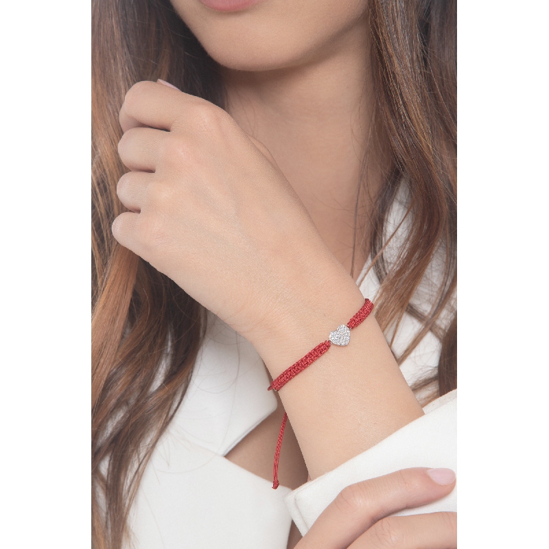 Red fabric cord bracelet with heart charm in white gold 18k and diamonds Red fabric cord bracelet with heart charm in white gold 18k and diamonds